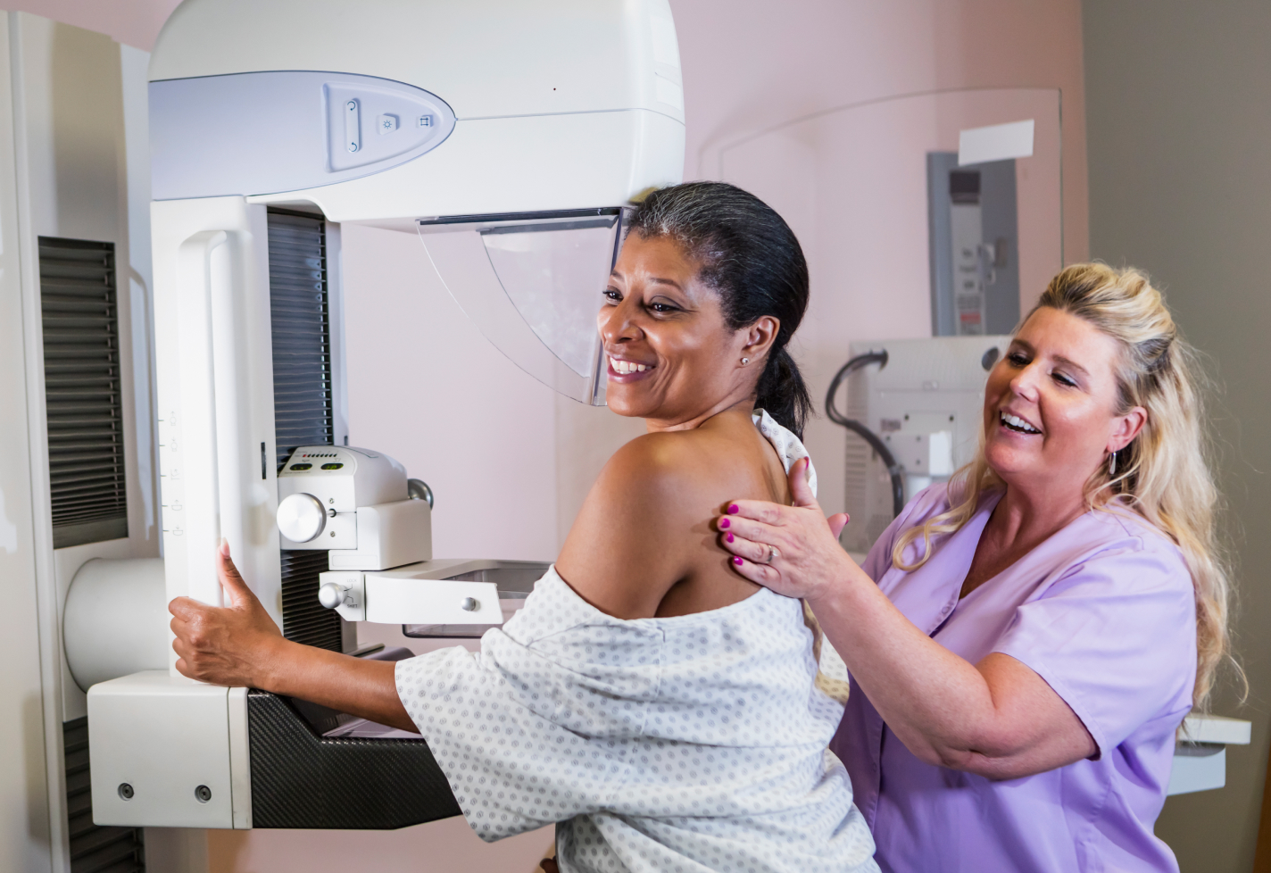 Nurse helping a woman during a mammogram