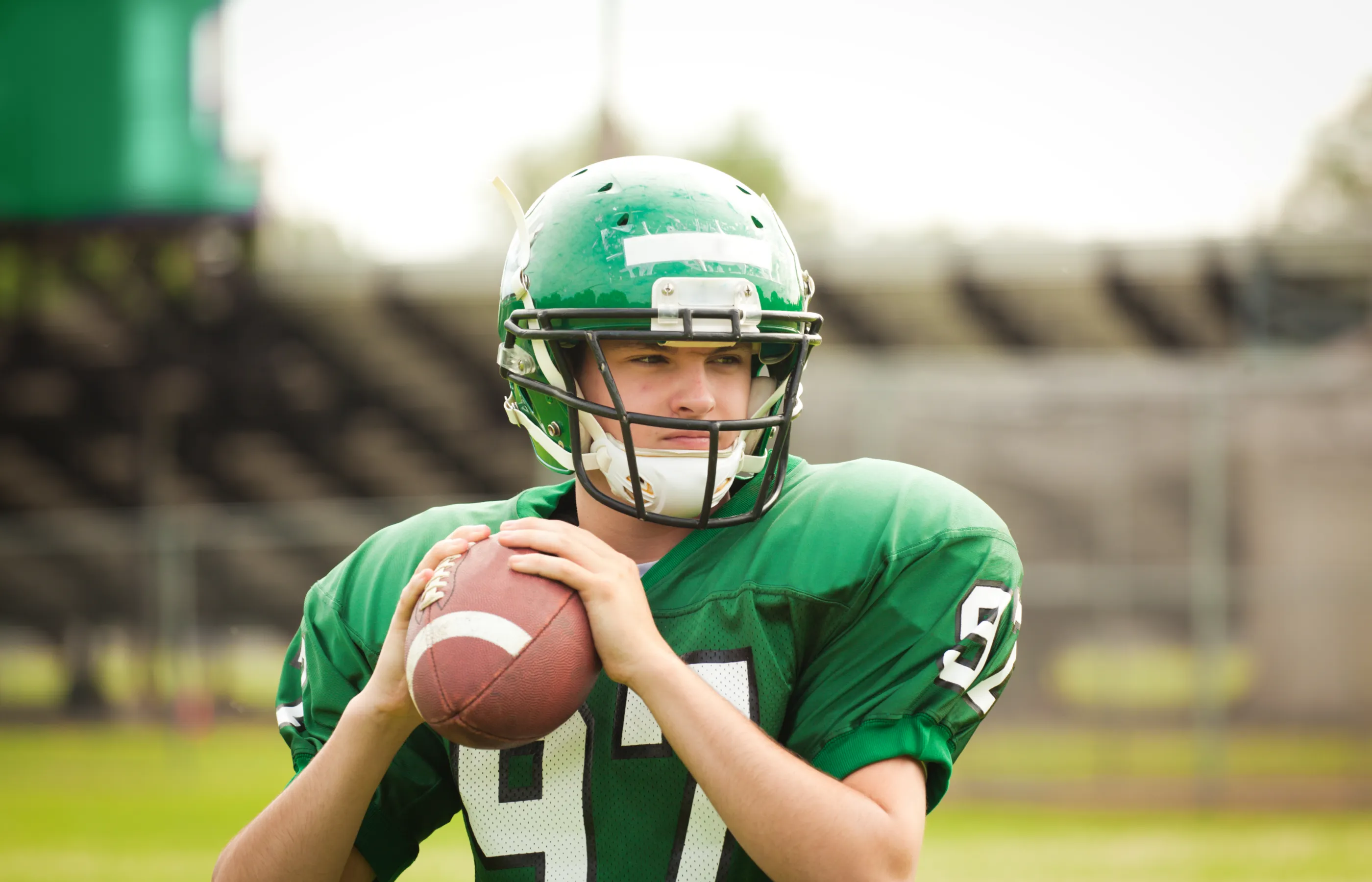 Young man playing in a football game. 