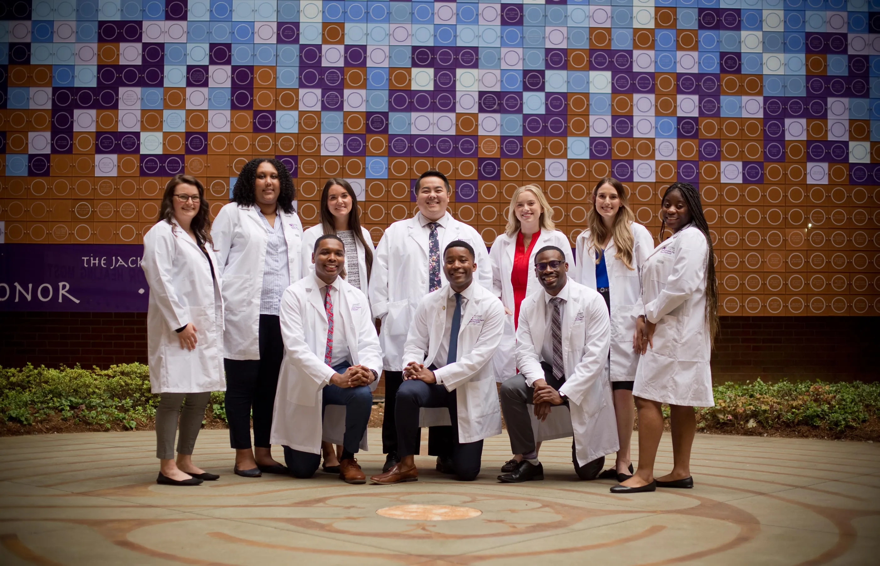 A group of pharmacy residents wearing lab coats. 