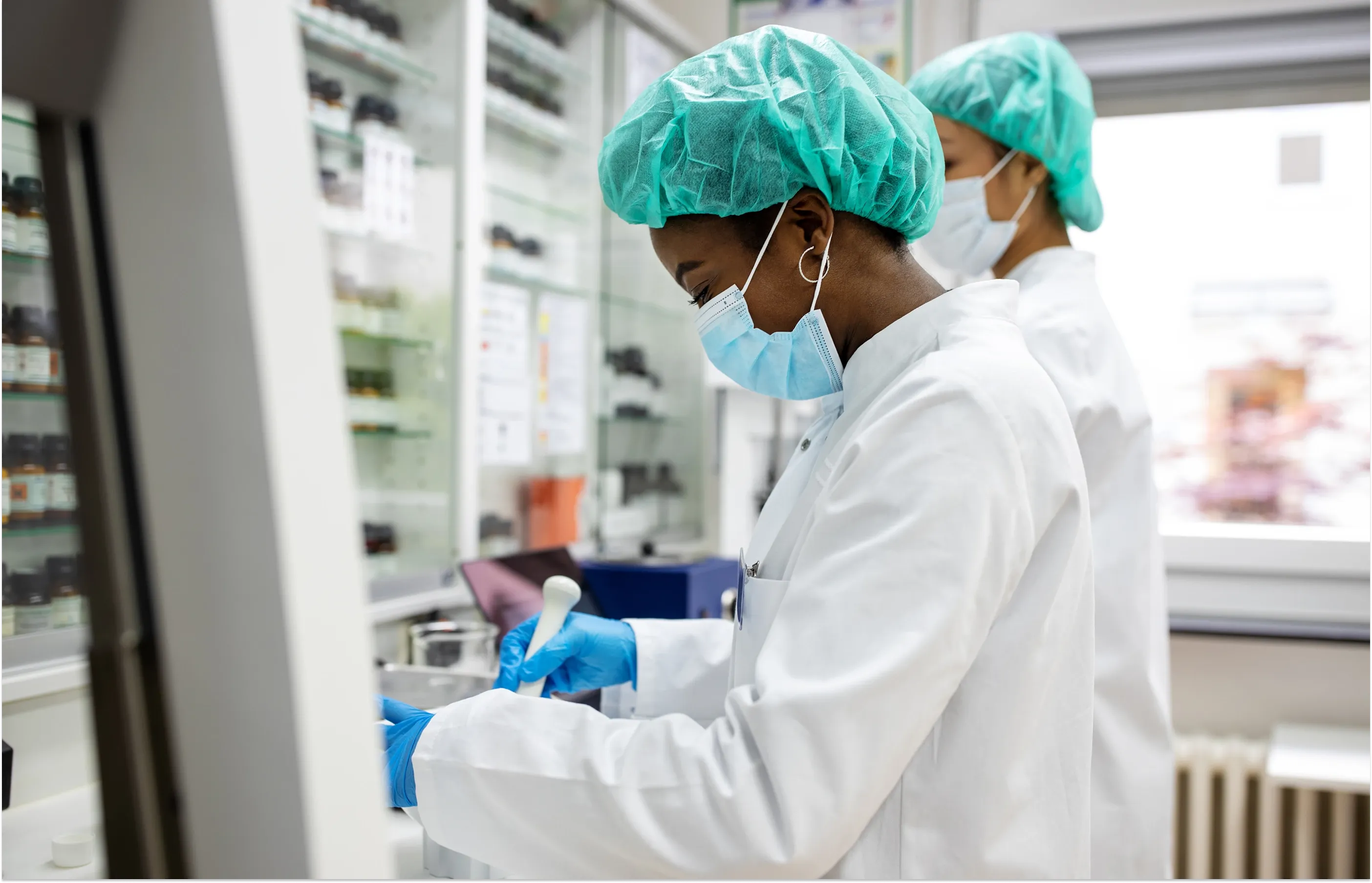 Two medical professionals testing samples in a laboratory