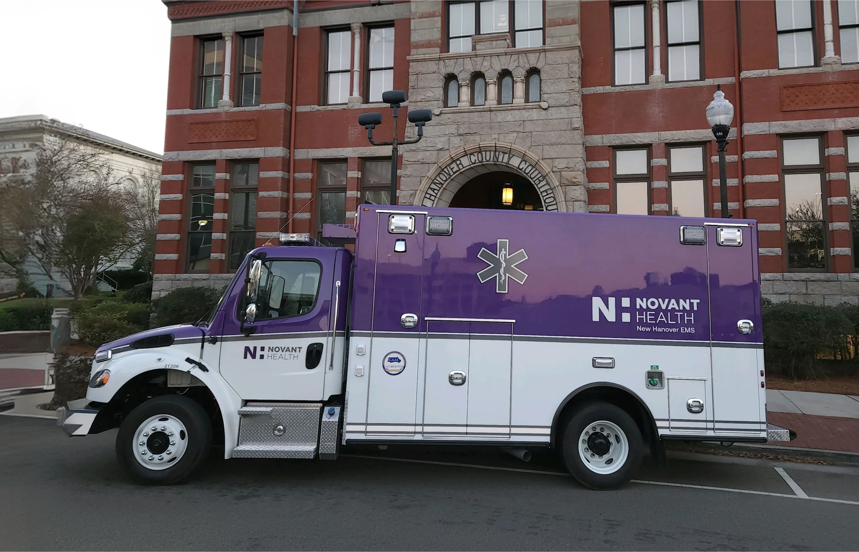 EMS community care truck parked in a park.