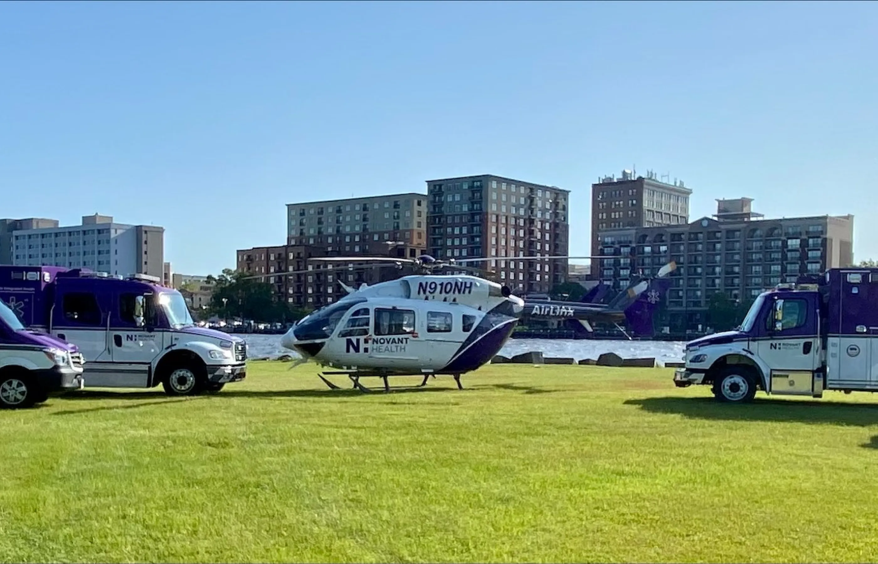 New Hanover emergency medical transport vehicles parked in a field.