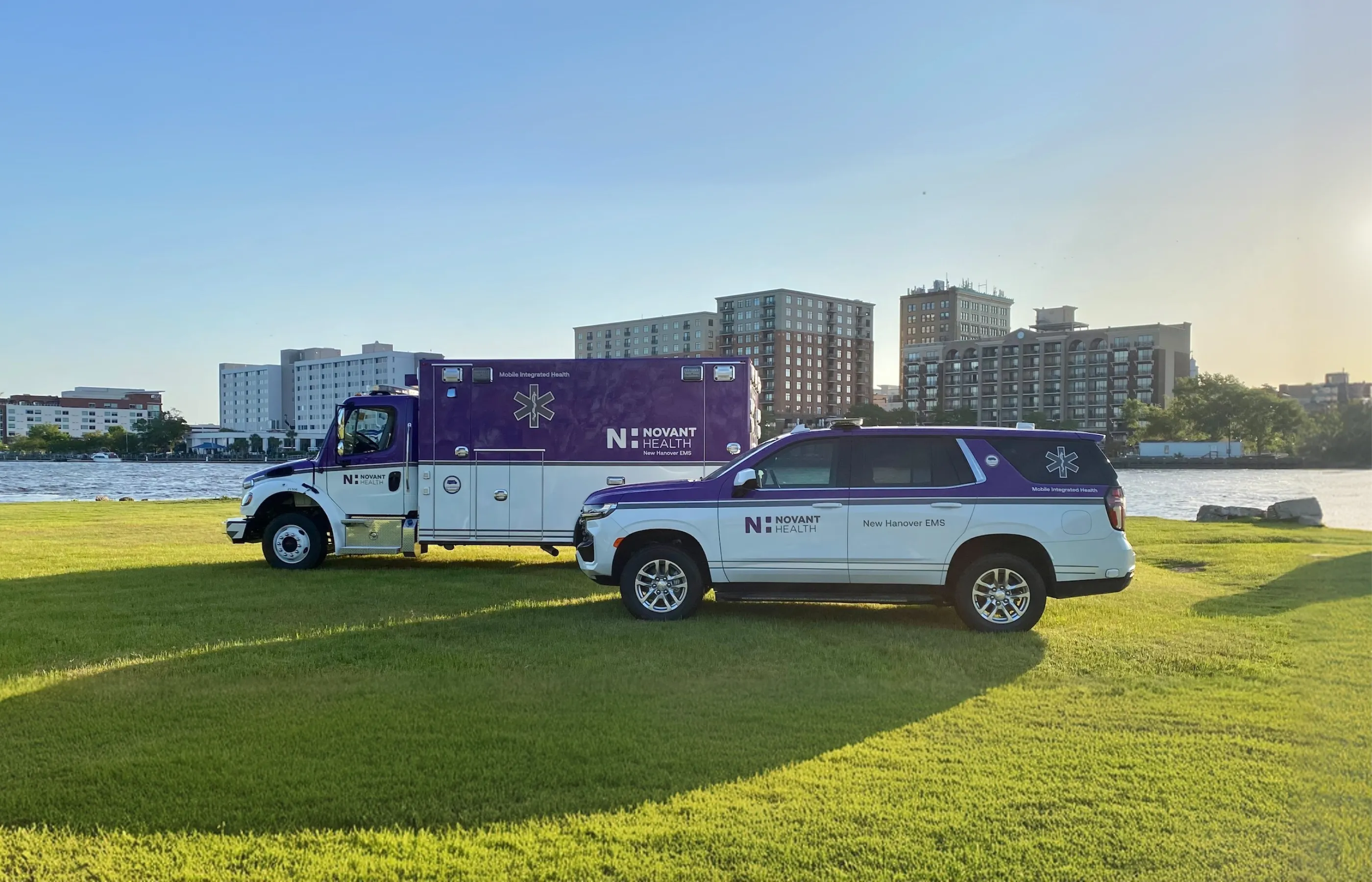 QRV community care ambulance parked in front of a lake.