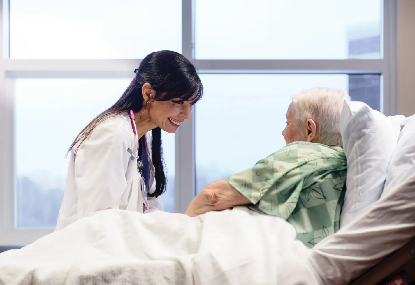 Female nurse with an elderly surgery patient