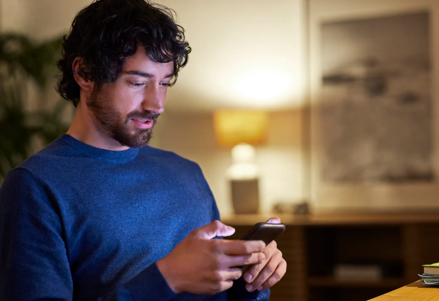 Man using his cellphone at home