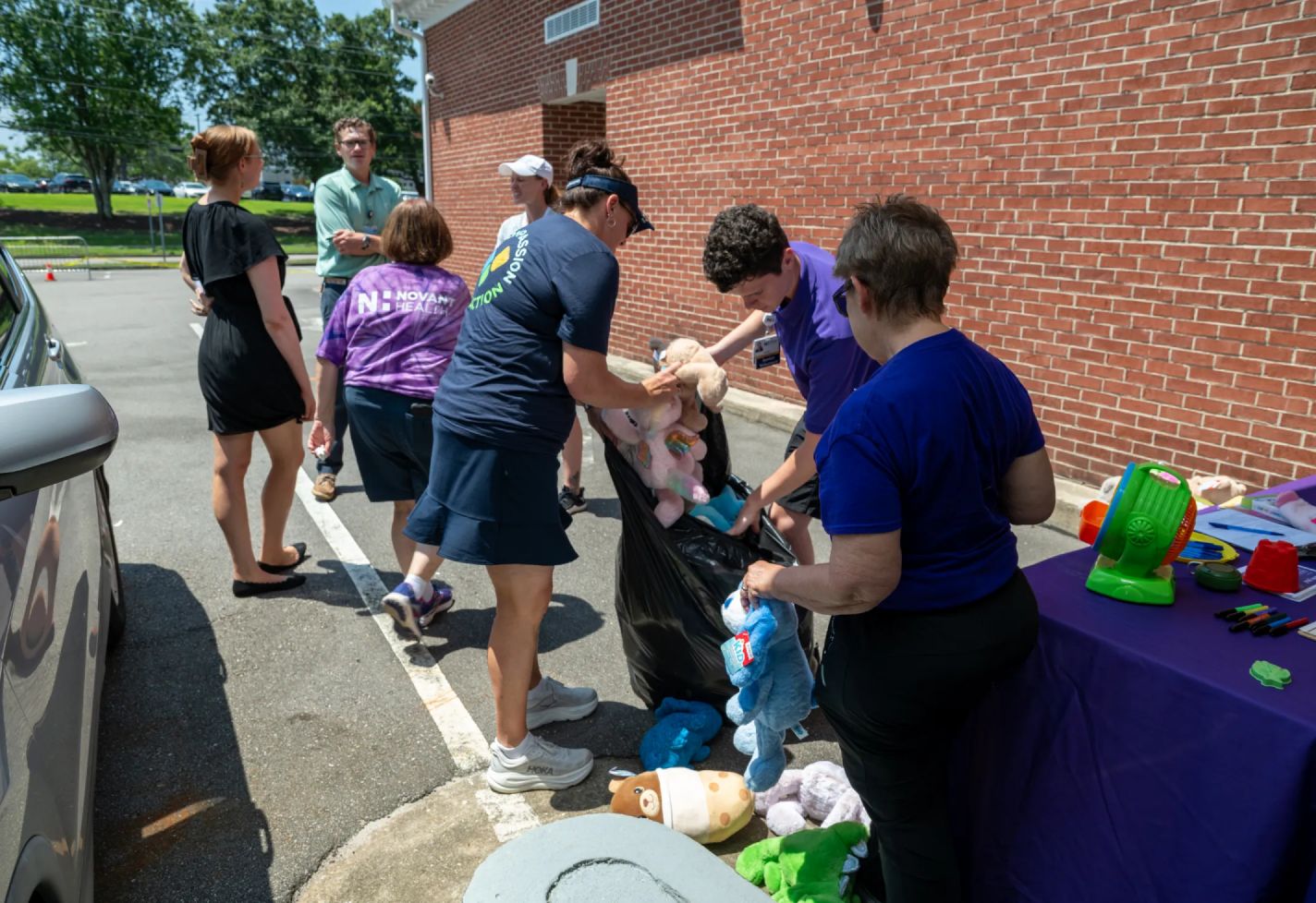 Novant Health volunteers working outdoors at a toy drive.