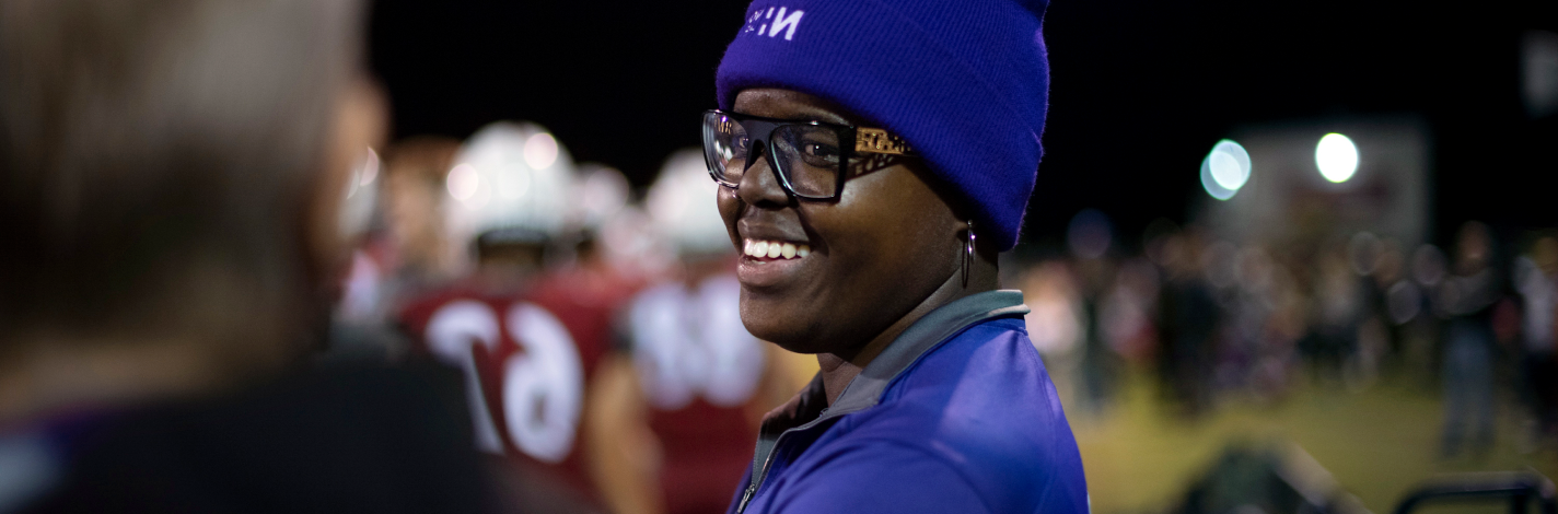 Christa Canty at a football game with a smile