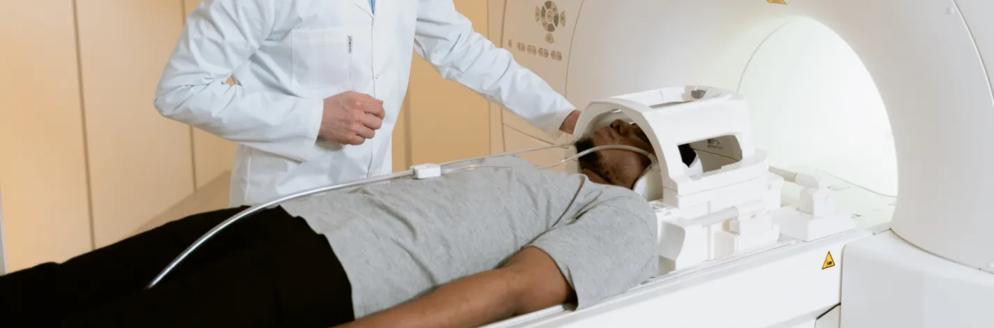 provider assisting a patient with an MRI 