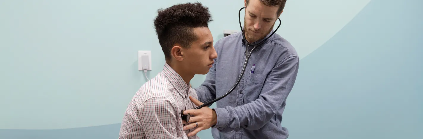 Provider listening to patient's heart