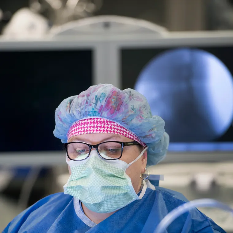 A Novant Health doctor is in an operating room participating in surgery.