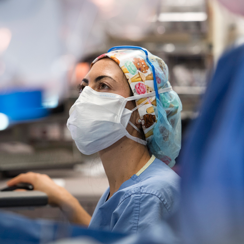 A surgical team member focused in the operating room.