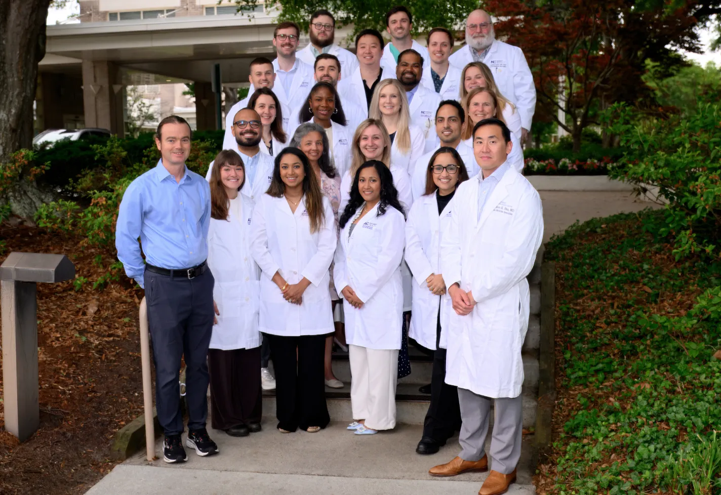 Wilmington internal medicine residents and faculty in white coats at graduation