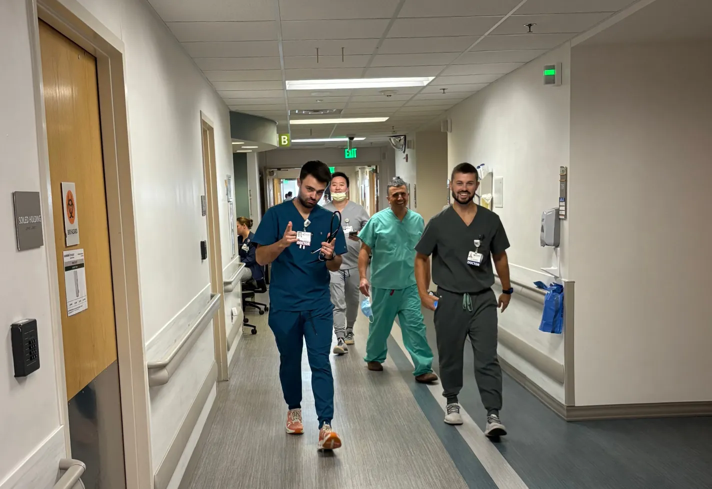 Wilmington, NC internal medicine residents walking and talking in a hallway
