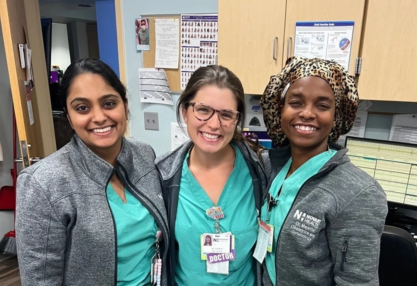 Group of Wilmington, NC ob-gyn residents smiling in office