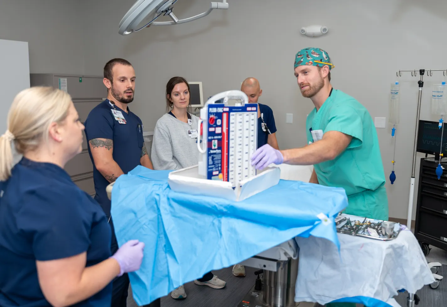 Surgery residents practicing in the Novant Health simulation lab at NHRMC