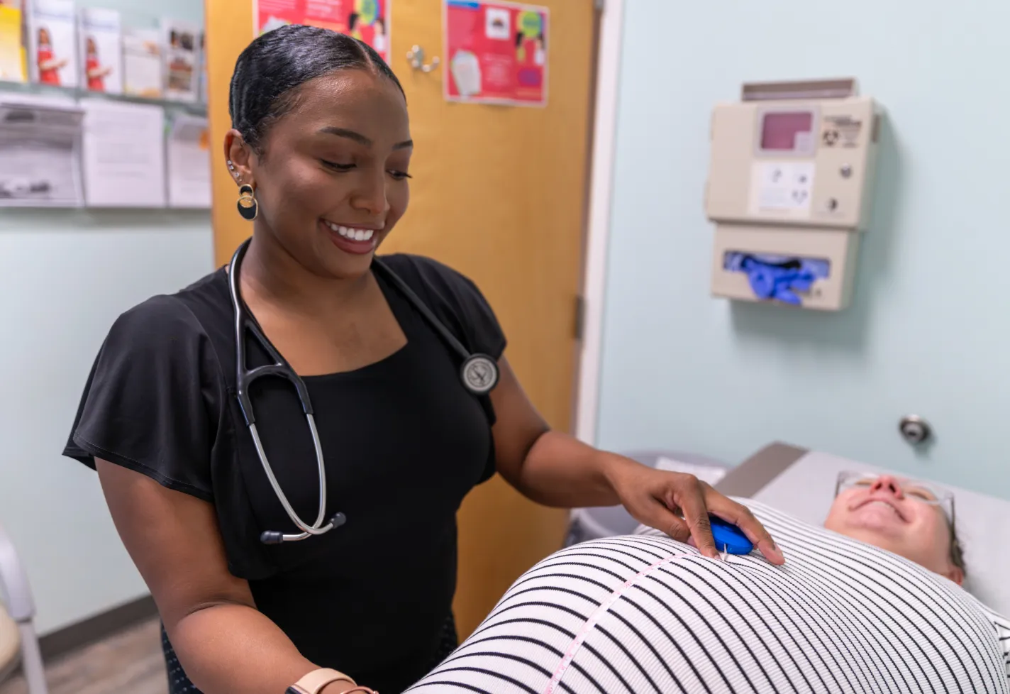 Novant Health Wilmington rural family medicine resident in a clinic with a maternity patient