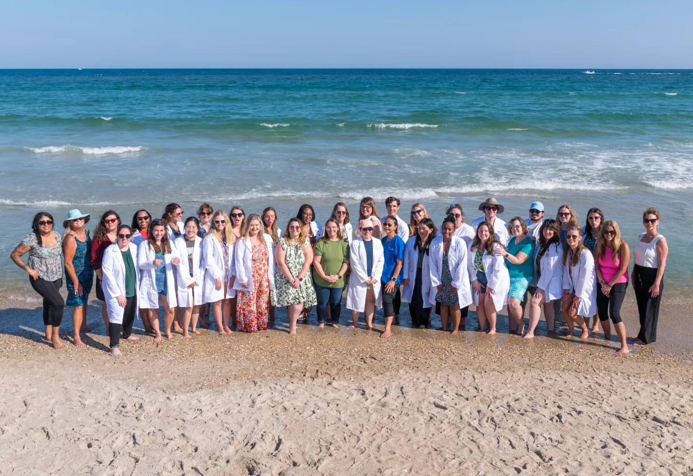 All Novant Health Wilmington family medicine residents on the beach shore