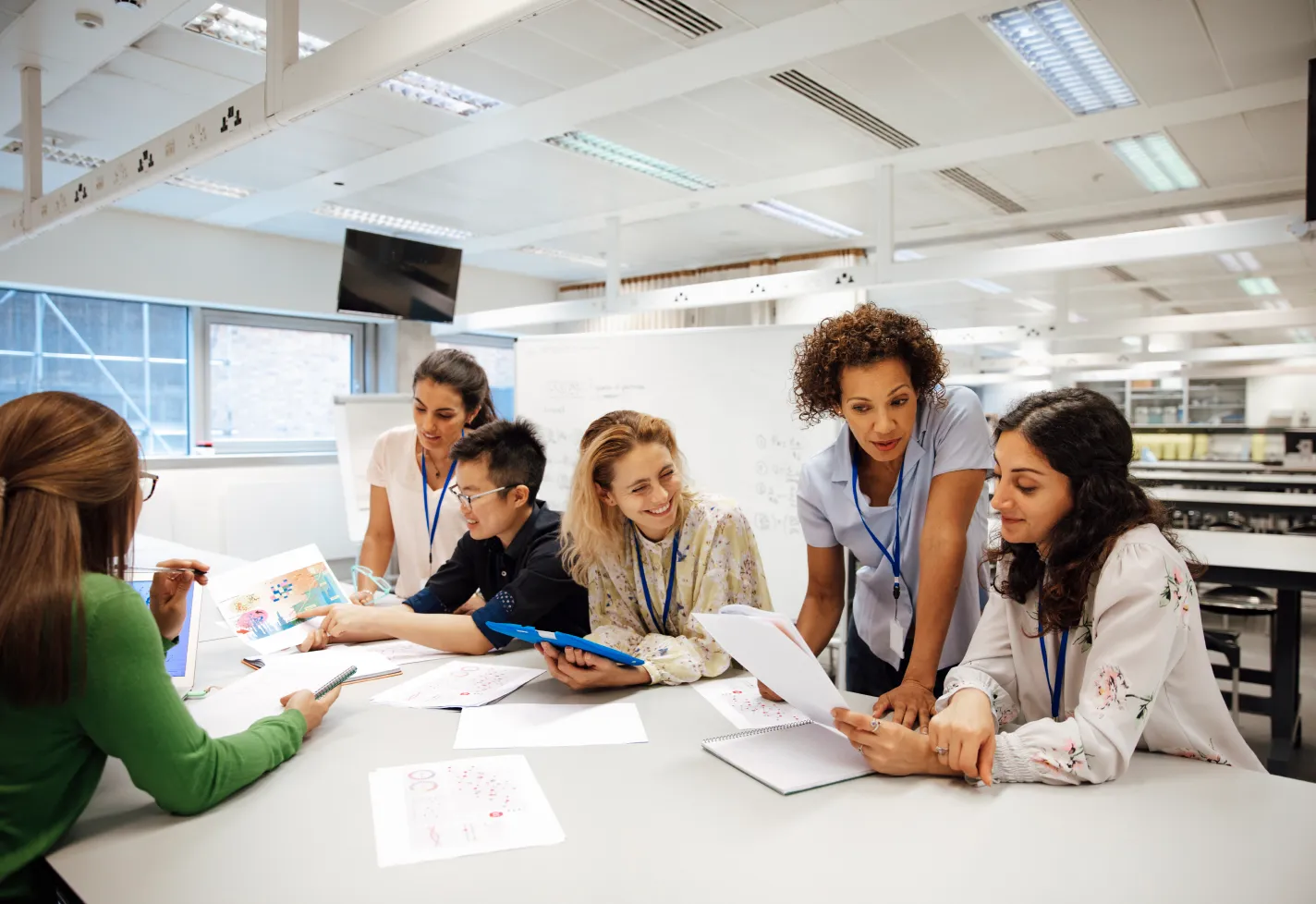 Group of young residents working together in a classroom