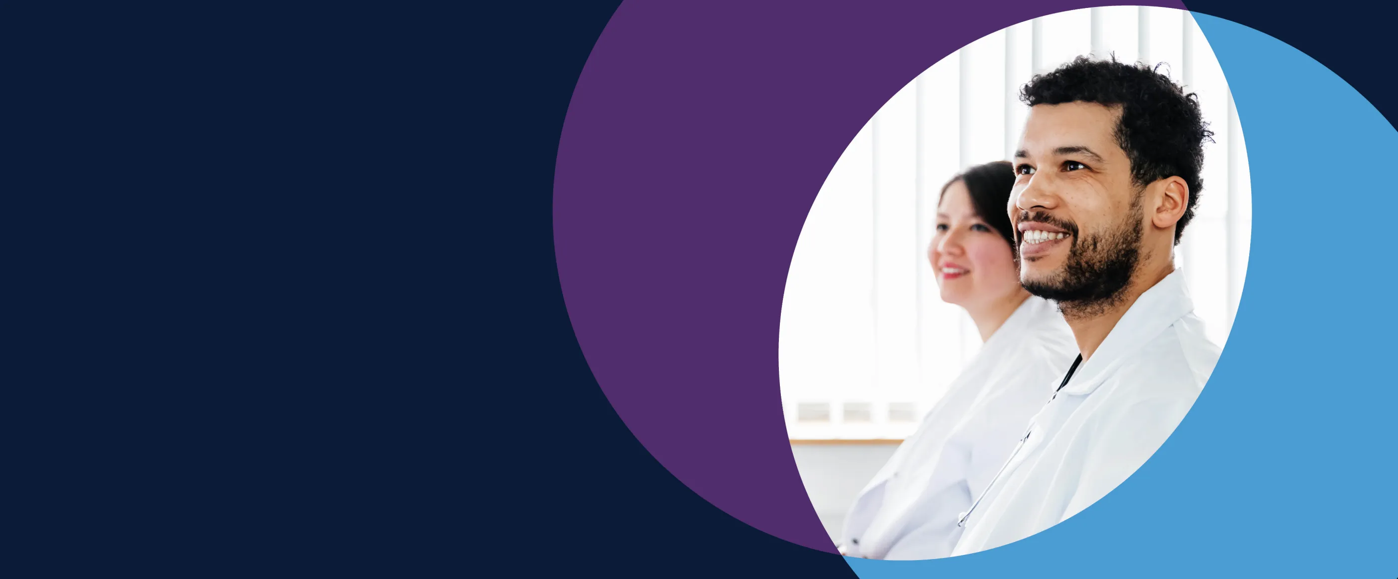 Two medical students smiling in white coats.  Two medical students smiling in white coats.
