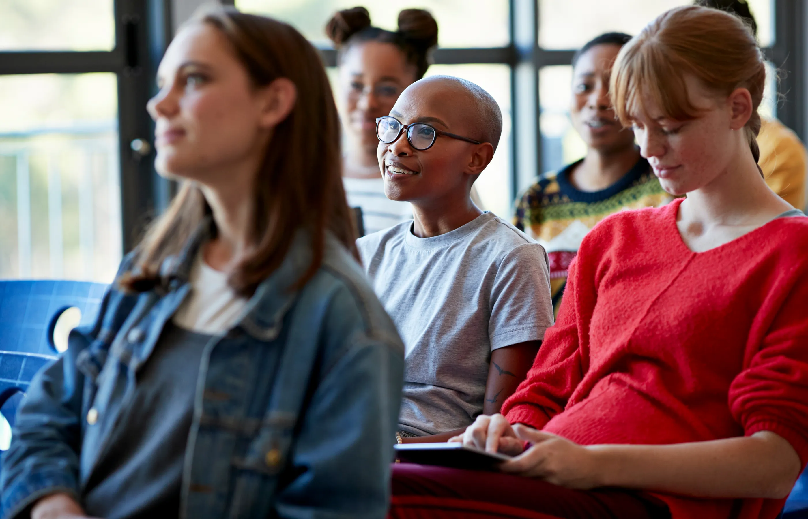 A group of young students in an mental health seminar.