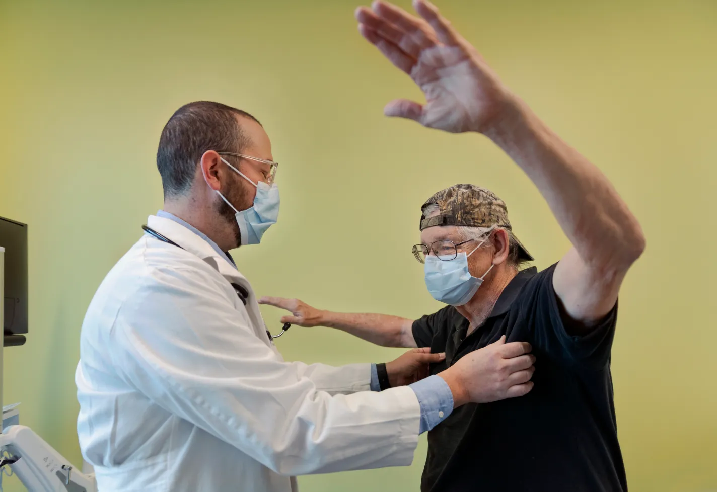 Dr. Skarbnik examines a patient Dr. Skarbnik examines a patient