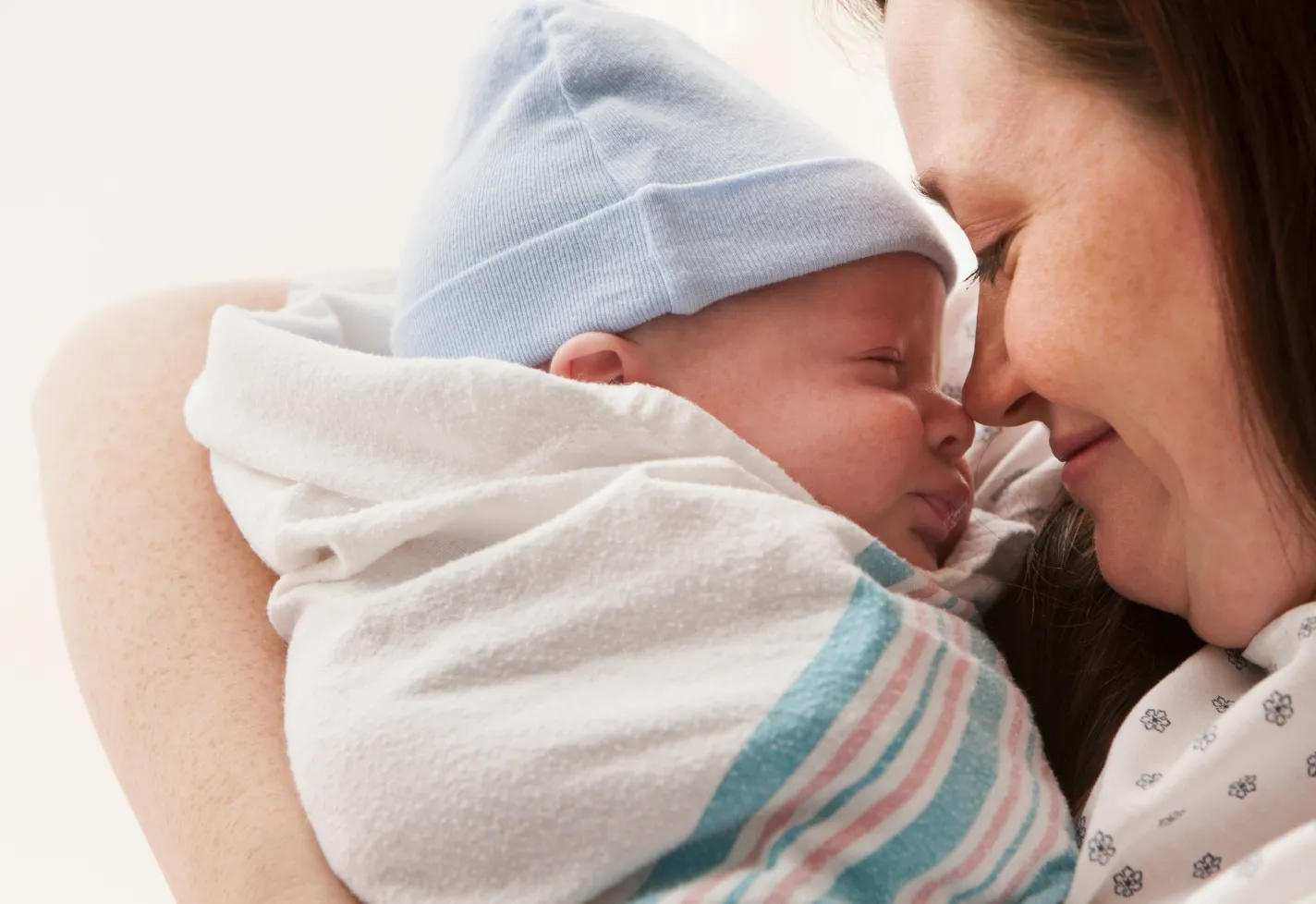 Smiling mother holding her newborn