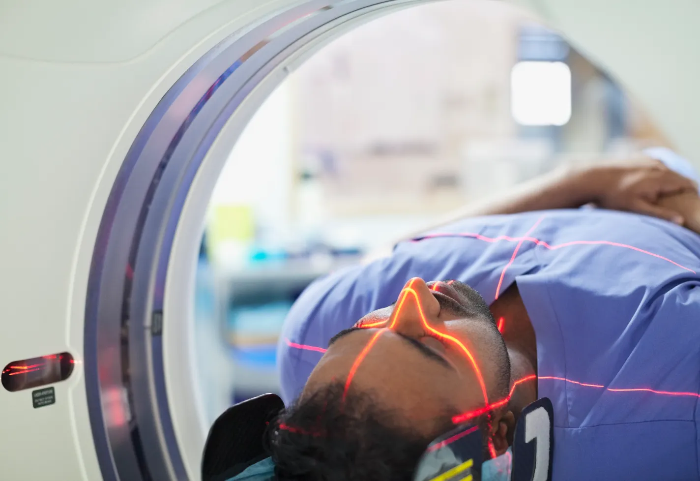 A patient is receiving an imaging scan. A patient is receiving an imaging scan.