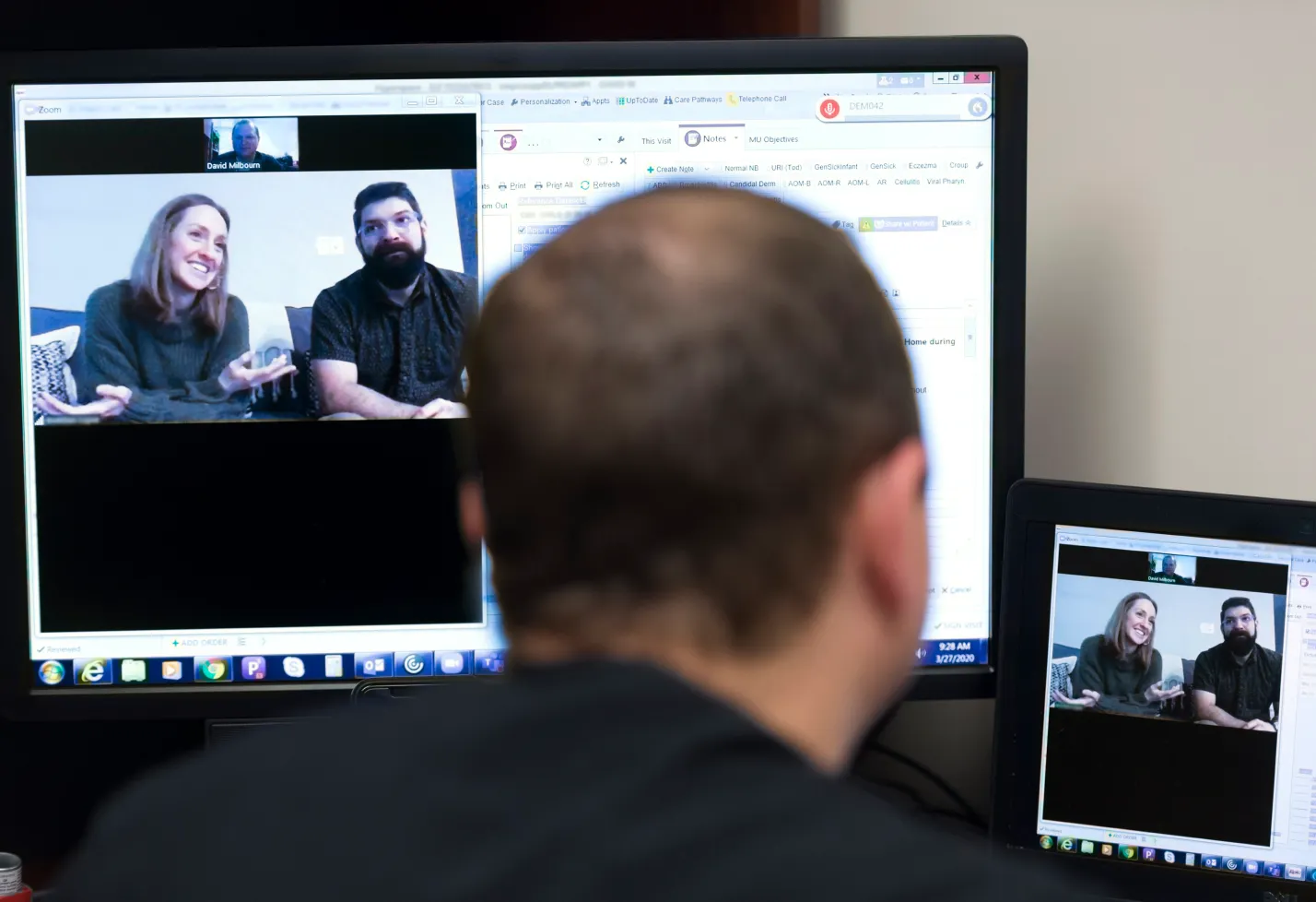 A Novant Health provider is on the computer talking with a couple in a virtual care visit. A Novant Health provider is on the computer talking with a couple in a virtual care visit.