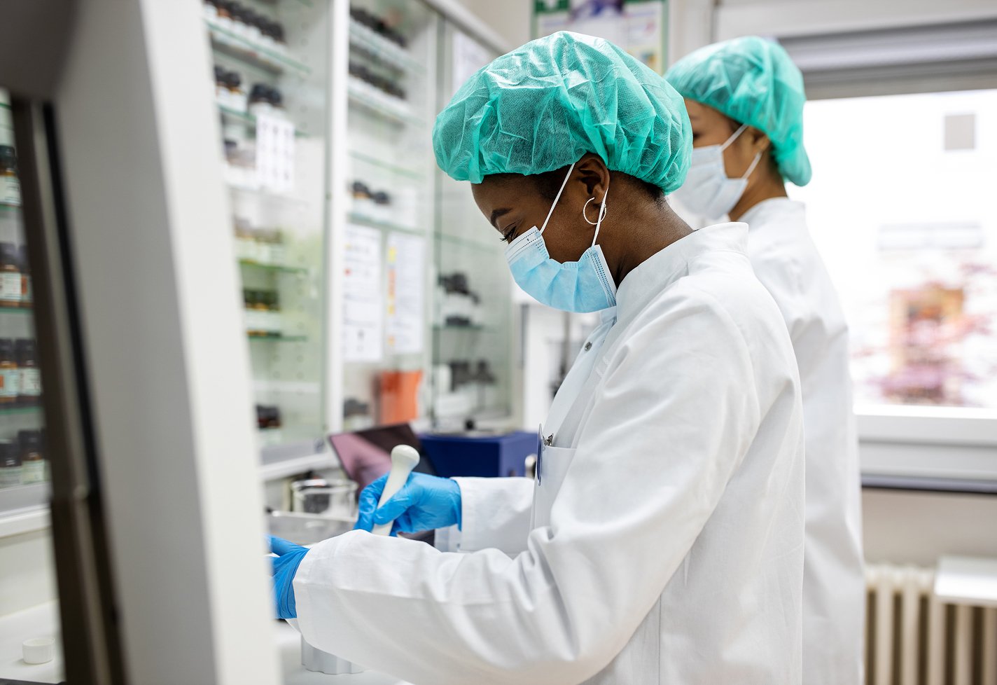 Two medical professionals testing samples in a laboratory