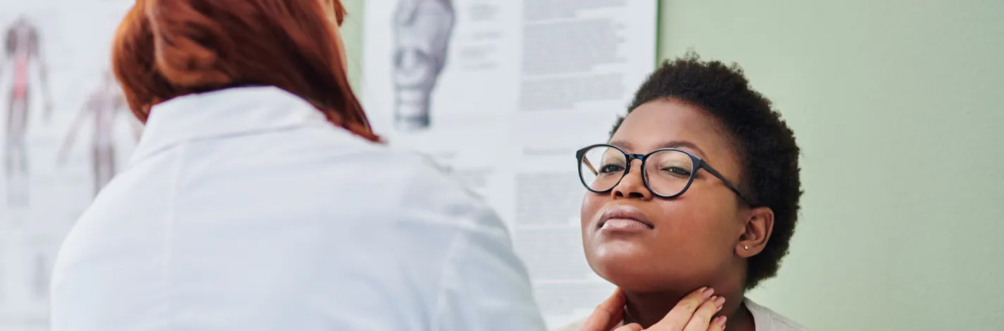 Provider giving a patient a neck exam