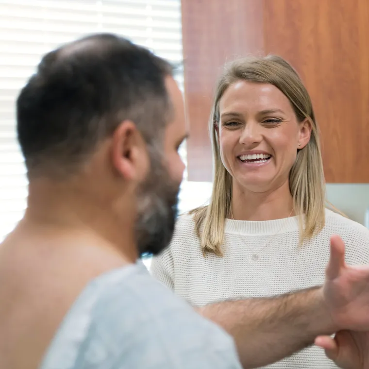 Novant Health's Doctor Jennifer Susanne Harvey treating patient's shoulder.